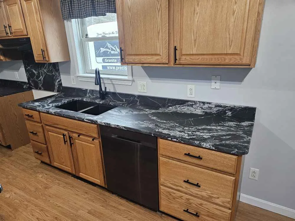 Black Forest leathered granite kitchen countertop installed by Precision Granite Works in Pittsfield, NH