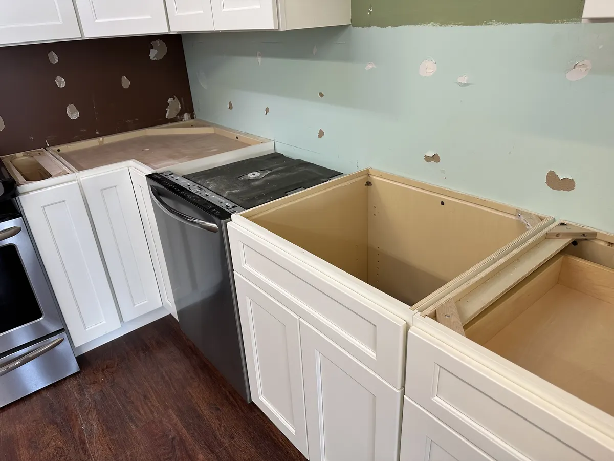 Installed kitchen cabinets ready for a countertop template appointment in a New Hampshire home