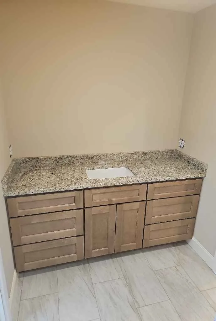 Giallo Ornamental granite bathroom vanity in an Epping, New Hampshire home