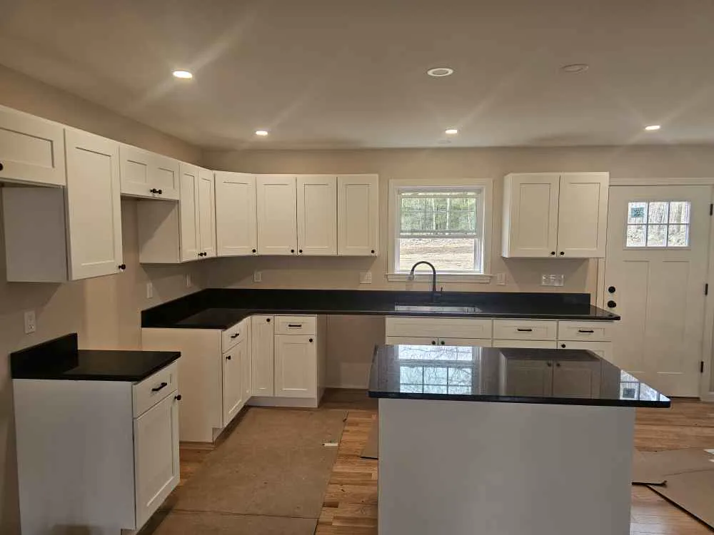 New kitchen countertop installation in Epsom, NH — granite vs quartz comparison