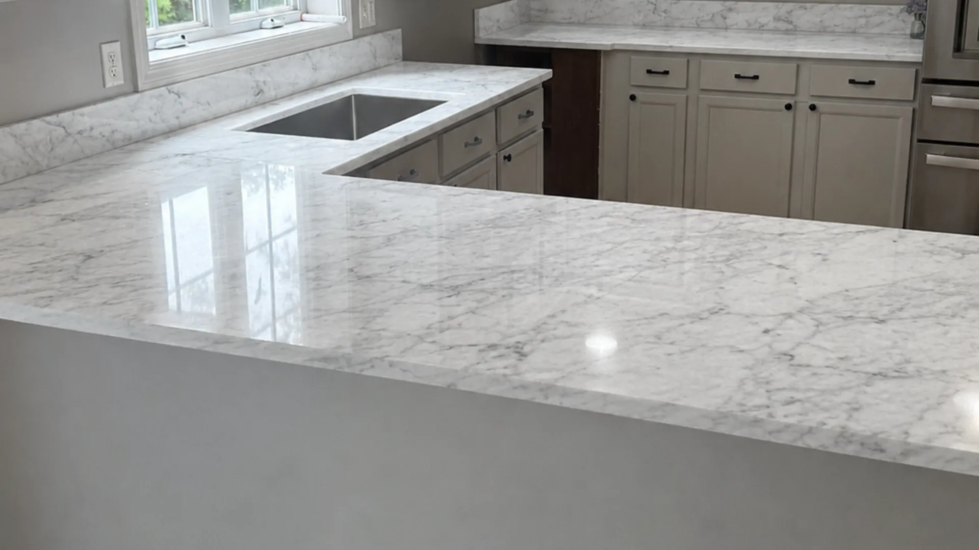 Marble countertop with soft grey veining installed in a New Hampshire home