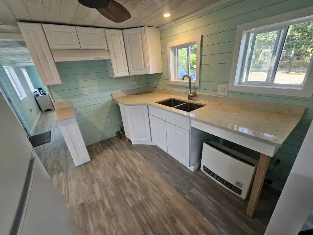Carrara Mist quartz kitchen countertop in a coastal cottage kitchen in York Beach, Maine