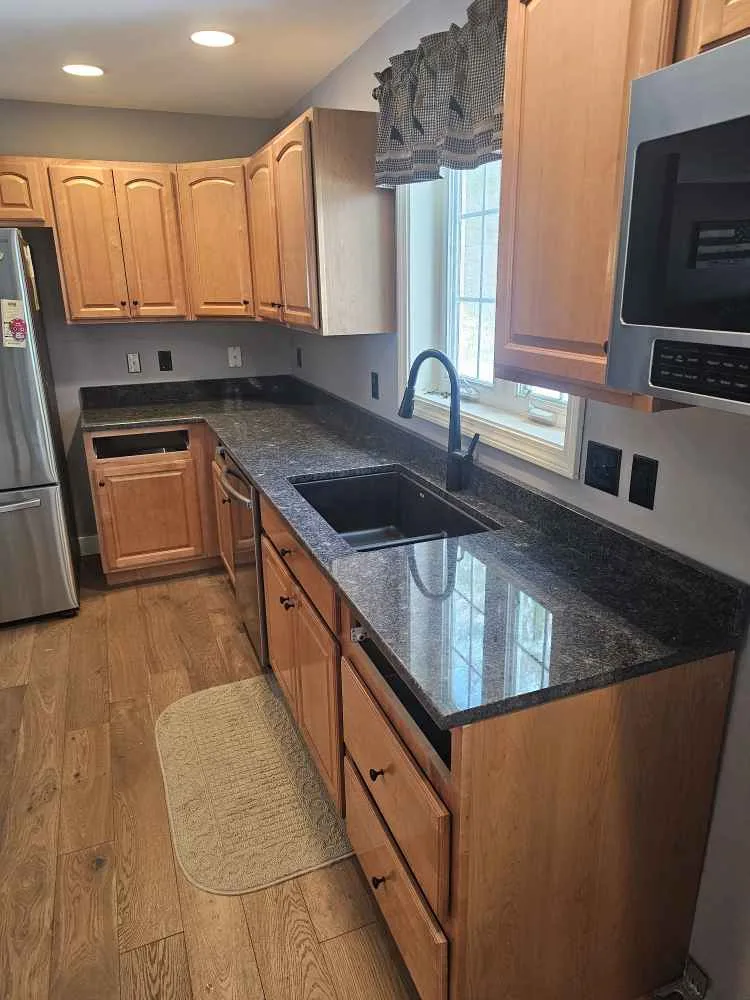 Silver Pearl granite countertops with undermount sink installed in a New Hampshire kitchen in Rochester