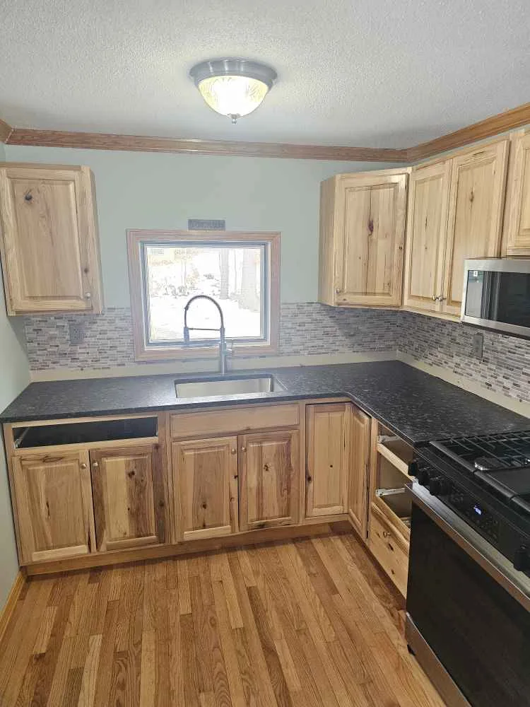 Steel Gray and Silver Pearl granite kitchen countertop in a New Hampshire home.