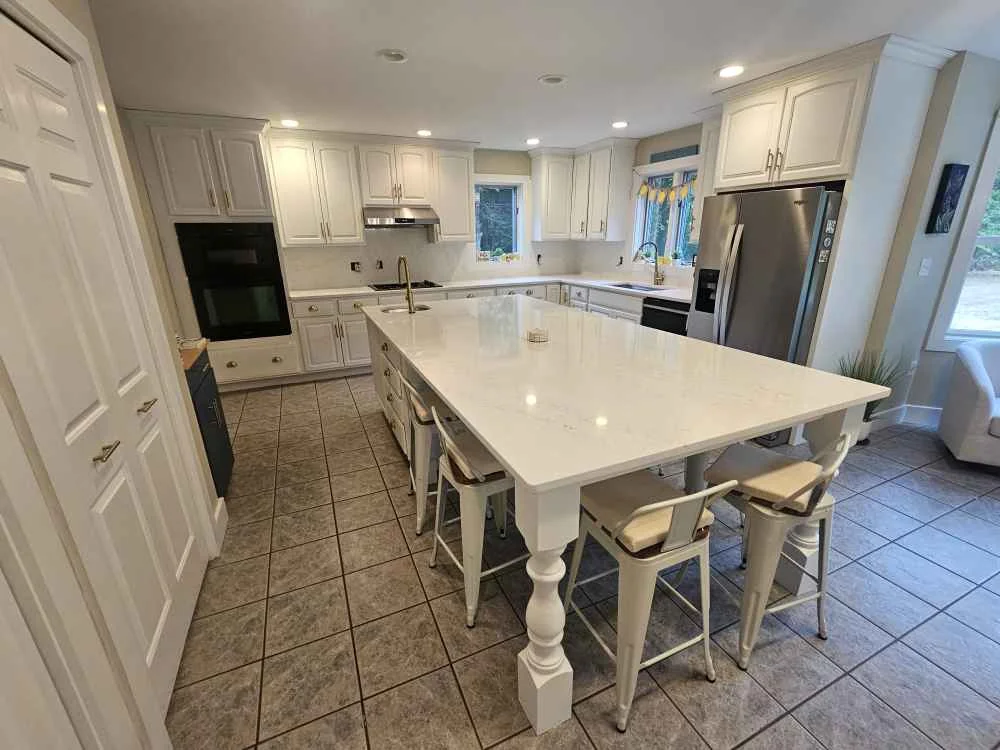 Quartz kitchen countertop with eased edge profile — custom countertop fabricated by Precision Granite Works in Wilmot, NH