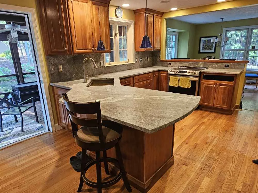 Leathered granite kitchen countertop in Bedford, NH — material shown in Precision Granite Works Epsom showroom