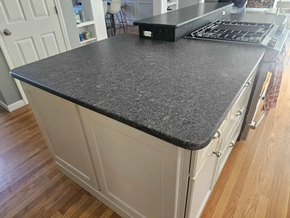 Silver Pearl leathered granite island countertop fabricated and installed by Precision Granite Works in Exeter, NH