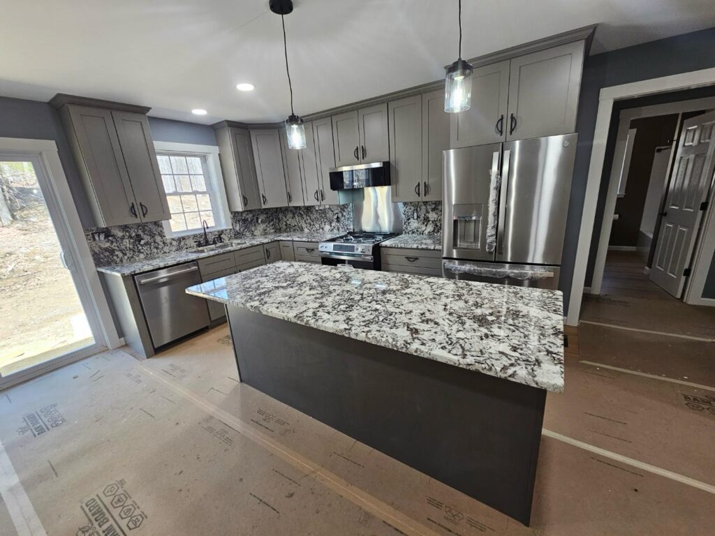 White and black custom countertop newly installed in a kitchen.