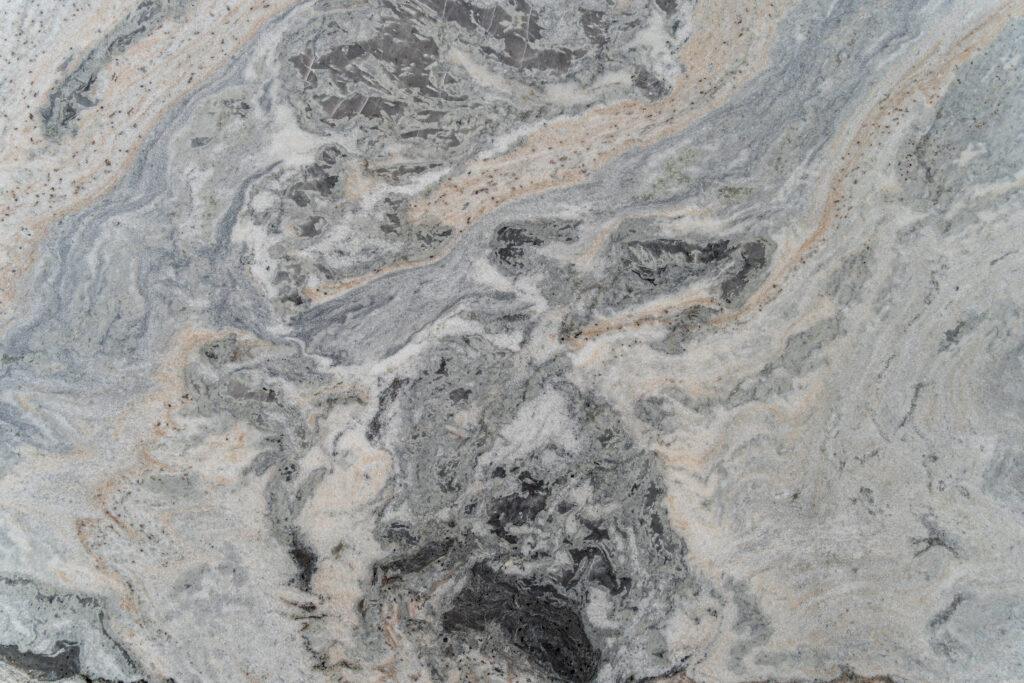 Gray quartzite slab with black and yellow lines and flecks.